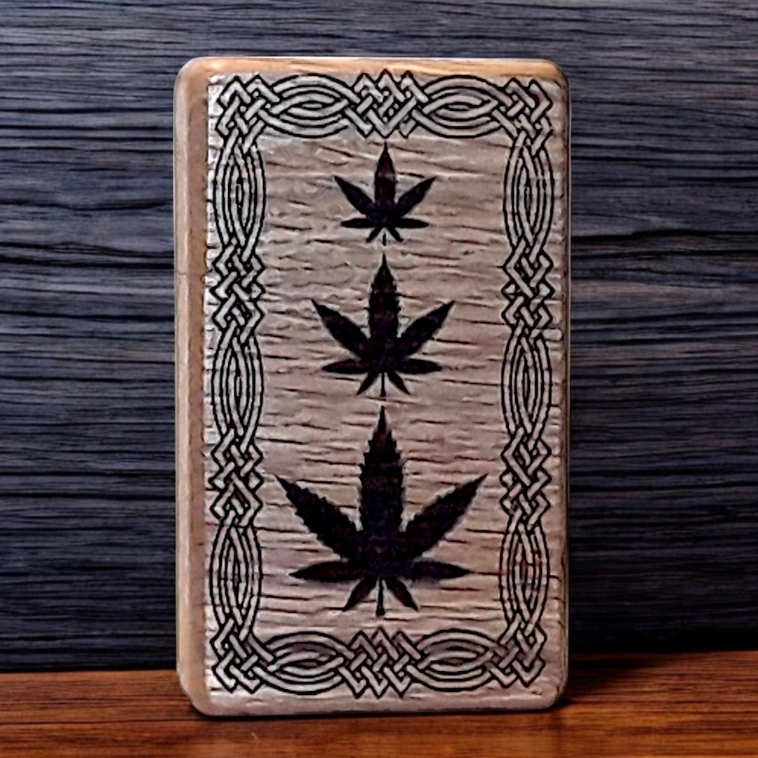 Image of a greenfoxx dugout Pot leaves in Celtic knot